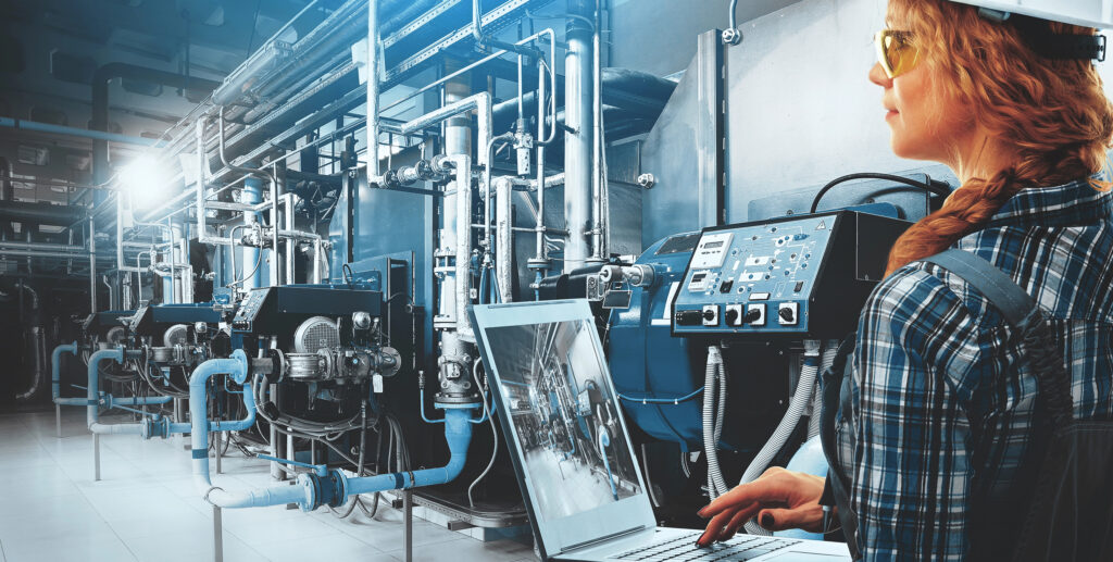 Engineers inspecting large boiler systems
