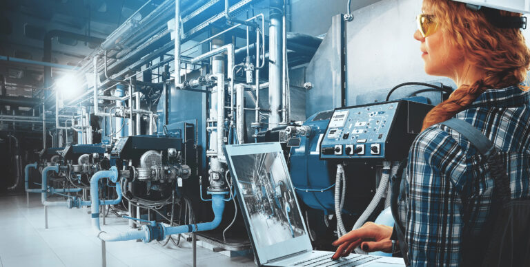 Engineers inspecting large boiler systems